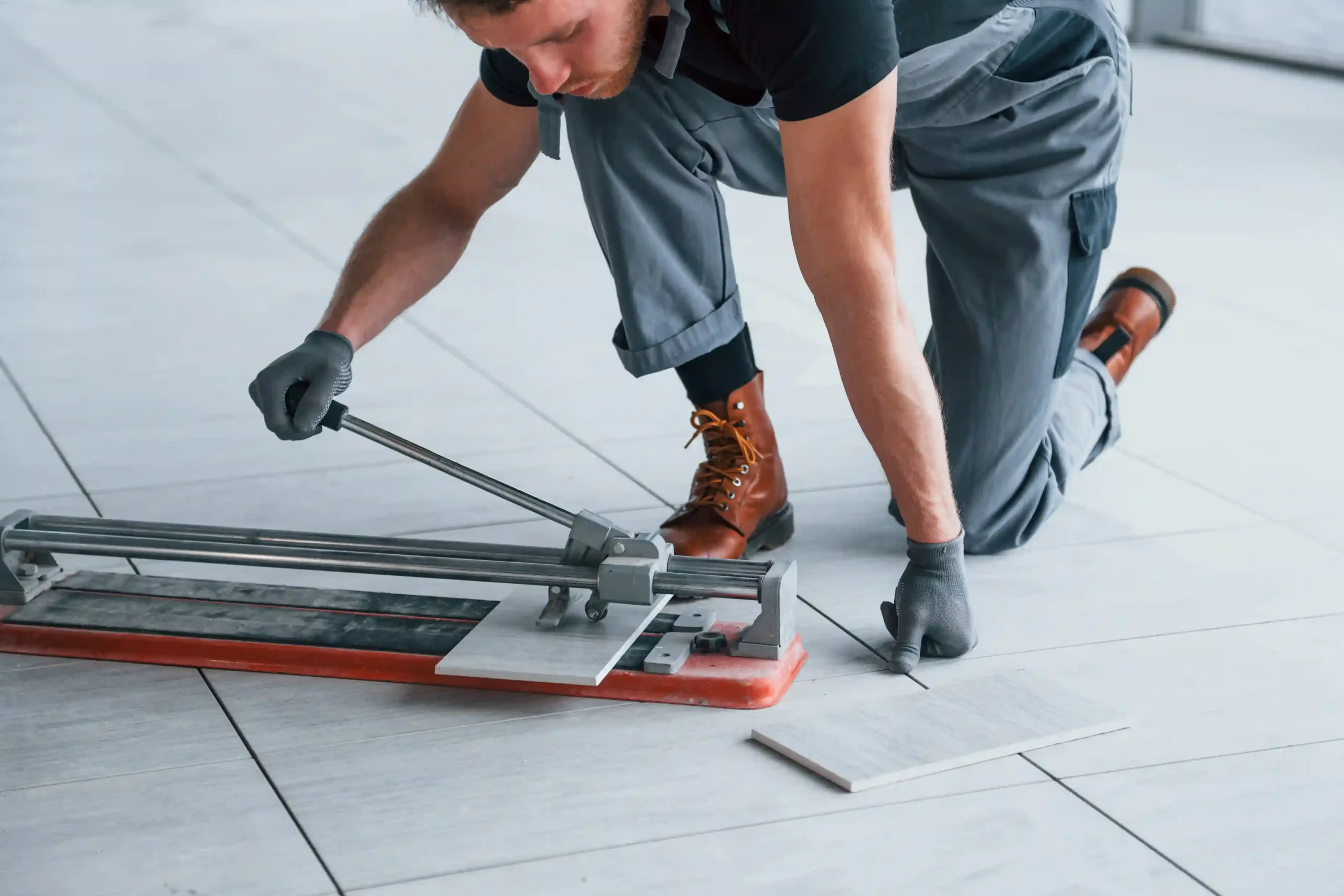 man-in-grey-uniform-installing-plate-indoors-in-mo-2025-03-18-20-12-50-utc